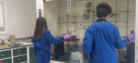 Two students working in a science lab