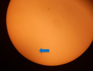Image of the sun with spot representing Mercury passing by