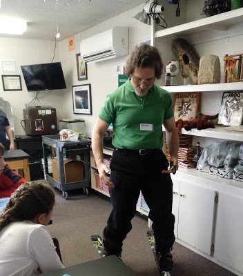 Edmund Start demonstrating a pair of skiis