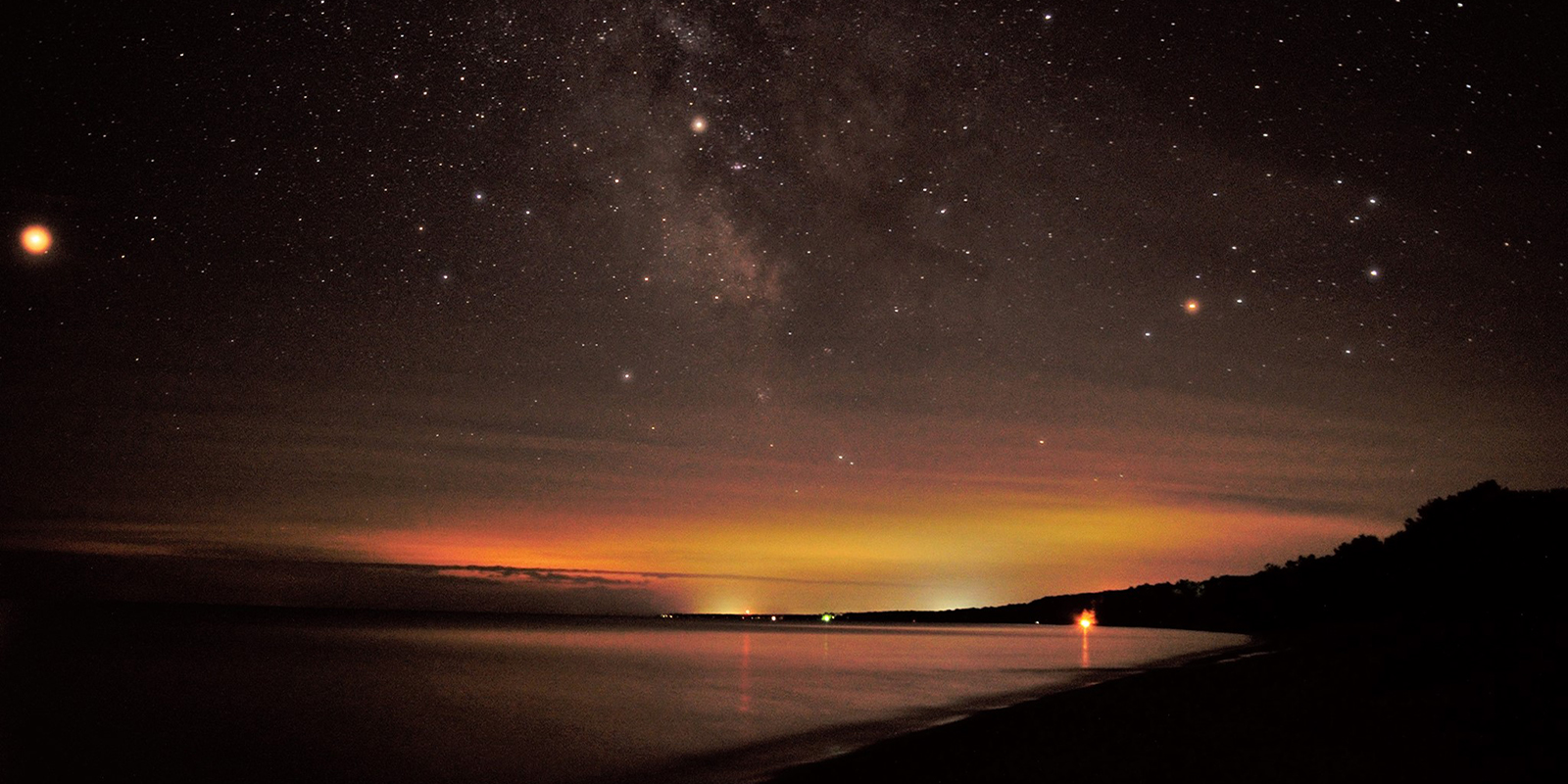 Evening landscape featuring stars in the sky